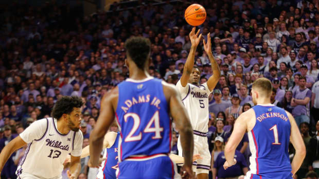Kansas State freshman guard Chris Carter (5) shoots for three against Kansas in the first half of the Sunflower Showdown inside Bramlage Coliseum Monday, February 5, 2024.  